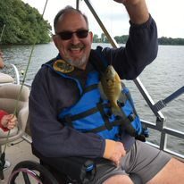 Older adult fishing on a boat